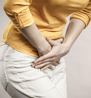 Woman holding her bladder